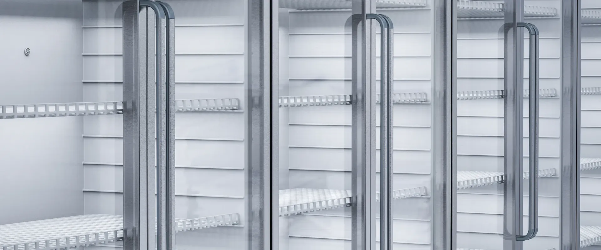 Engineer repairing a commercial fridge